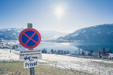 Scenic view on sunny mountain landscape with winter lake in Zell am see, Austriaの写真素材