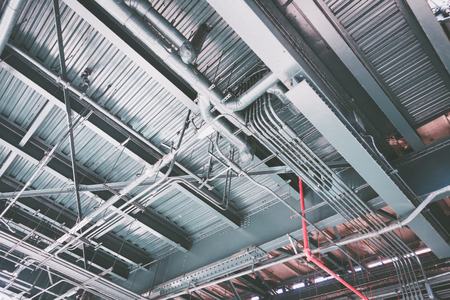 Industrial metal construction from pipes from below. の写真素材