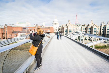 LONDON, UK - 17 FEBRUARY, 2017: Millenium Bridge is a steel suspension bridge for pedestrians crossing the River Thames in Londonのeditorial素材
