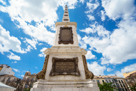 MALAGA,SPAIN - 28 MAY 2016:View on famous monument on Merced square against of blue sky with white clouds.From belowのeditorial素材