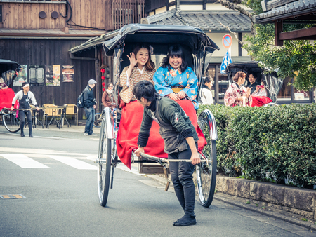 KYOTO, JAPAN - MARCH 24: Typical tickshaw on March 24, 2015 in Kyoto, Japan. Nene-no-Michi Lane is a wonderful flagstone walkway that links some of the most important sights in the Southern Higashiyama area.のeditorial素材