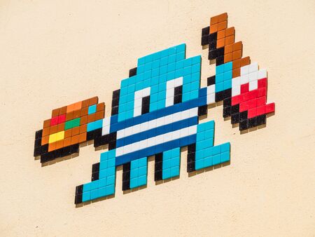 MALAGA, SPAIN: AUGUST 18, 2018: pacman sign made by the French graffiti mosaic artist known as 'Invader'.のeditorial素材