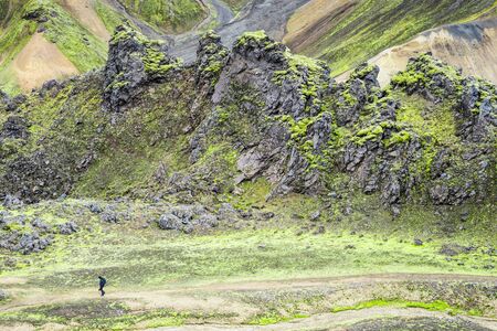 LANDMANNALAUGAR, ICELAND  September 10, 2017: Hikers climb up hills in Landmannalaugar with mountains background.のeditorial素材