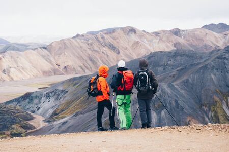 LANDMANNALAUGAR, ICELAND  September 10, 2017: Hikers climb up hills in Landmannalaugar with mountains background.のeditorial素材