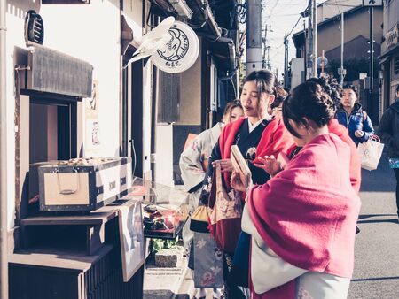 KYOTO, JAPAN - MARCH 24: Unidentified Japanese ladies with Kimono dress, Japanese traditional costume on March 24, 2015 in Kyoto, Japan.のeditorial素材