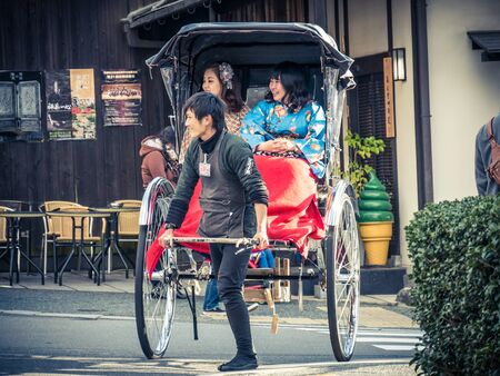 KYOTO, JAPAN - MARCH 24: Typical tickshaw on March 24, 2015 in Kyoto, Japan. Nene-no-Michi Lane is a wonderful flagstone walkway that links some of the most important sights in the Southern Higashiyama area.のeditorial素材