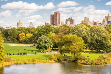 Central Park, New York, USA - 23 October, 2016: people laying on green grass.のeditorial素材