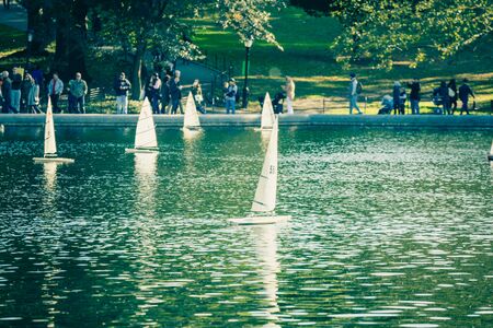 Central Park, New York, USA - 23 October, 2016: small ships sailing in pond.のeditorial素材