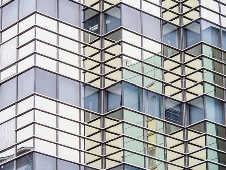 Front view of skyscraper windows on sunny day.の写真素材