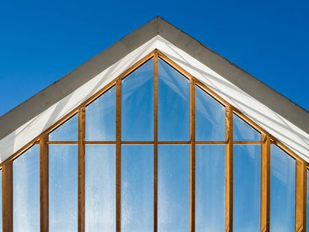 Front view of skyscraper windows on sunny day.の写真素材