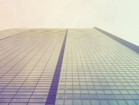 Front view of skyscraper windows on sunny day.の写真素材