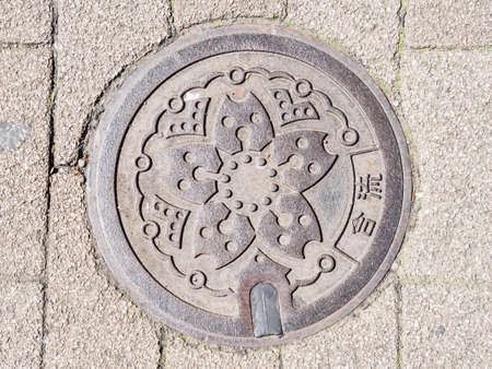 TOKYO; JAPAN - APRIL 11, 2018: Iron sewer in Roppongi crossingのeditorial素材