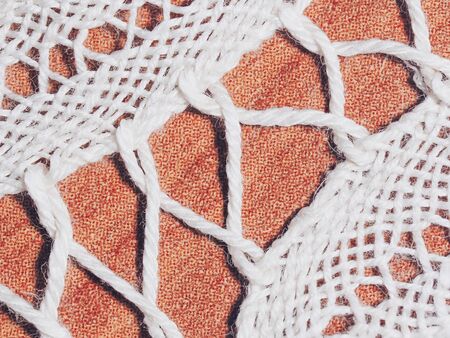 White handmade lace on brown background
