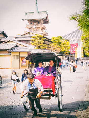 KYOTO, JAPAN - APRIL 02, 2018: Typical tickshaw. Nene-no-Michi Lane is a wonderful flagstone walkway that links some of the most important sights in the Southern Higashiyama area.のeditorial素材