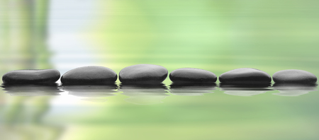 stones isolated on waterの写真素材