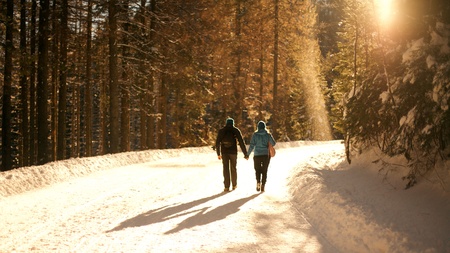 A Couple walking  on the snow in Morskie Oko, Polandの写真素材