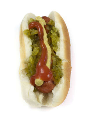 A hot dog stuffed with toppings on a white backgroundの写真素材