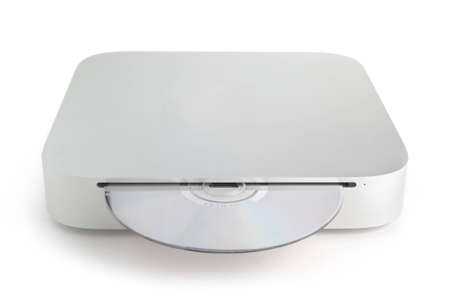 A mini computer on a white background with a CD disc in the front CD drive