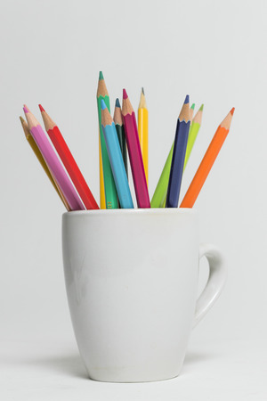 A group of colored pencils on a white isolated backgroundの写真素材