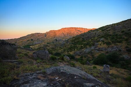 Beautiful landscape in the mountains in summer. It is an orange sunset in Spain.