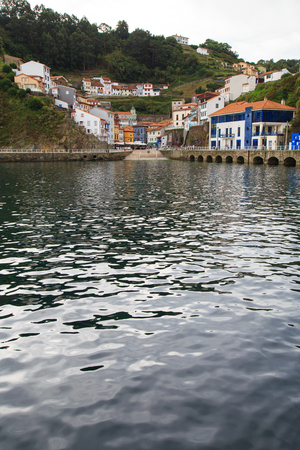 View from water to Cudillero, small fishing village in Asturias, Spain.の写真素材
