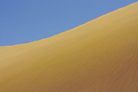 A photo of the warm texture of a desert.の写真素材