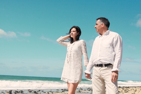 couple standing looking very relaxed Coastの写真素材