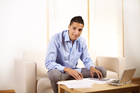 Portrait of a young businessman using a Tablet PC.の写真素材