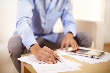 Portrait of a young businessman working with documents.の写真素材
