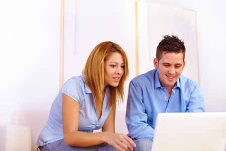 Portrait of a young business couple working on the living-room.の写真素材
