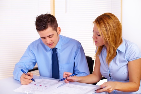 Portrait of two business people working on the office.の写真素材
