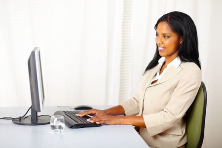 Portrait of a attractive businesswoman using a computerの写真素材