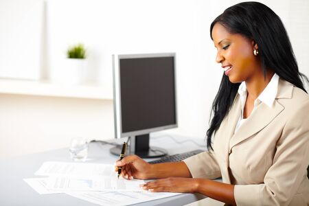Portrait of a friendly female executive on workの写真素材