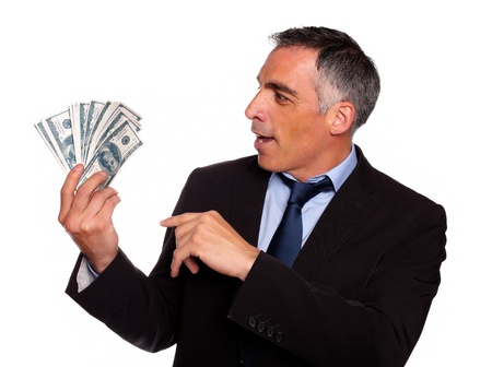 Portrait of a ambitious executive looking plenty of dollars on isolated backgroundの写真素材