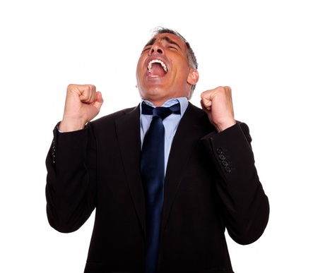 Portrait of a excited man screaming and celebrating a victory on isolated backgroundの写真素材