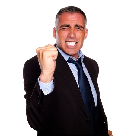 Portrait of a positive business man excited on black suit on isolated backgroundの写真素材