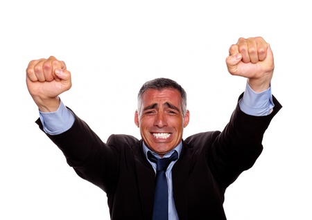 Portrait of a adult latin man with a winning attitude on isolated backgroundの写真素材