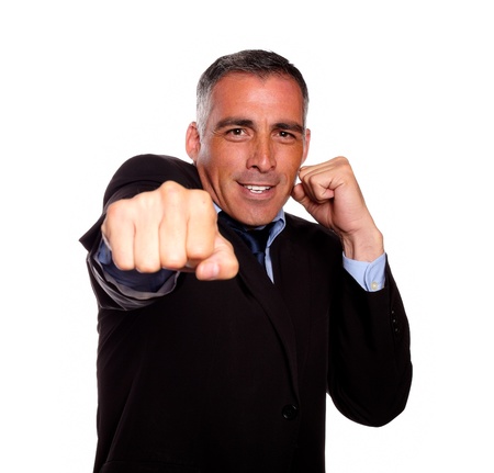 Portrait of a hispanic business man boxing on isolated backgroundの写真素材