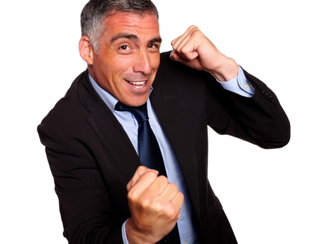 Portrait of a friendly hispanic businessman boxing on isolated backgroundの写真素材