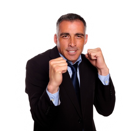 Portrait of a elegant executive man smiling and boxing on isolated backgroundの写真素材