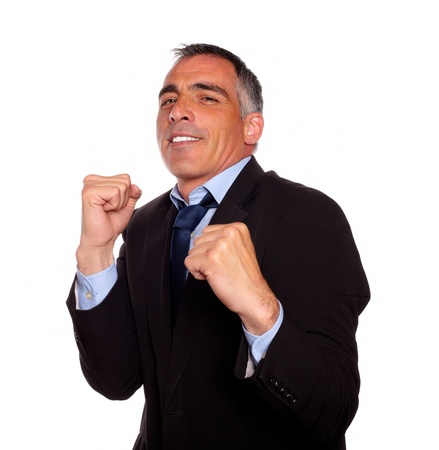 Portrait of a elegant latin business man on black suit boxing against white backgroundの写真素材