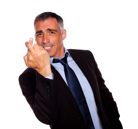 Portrait of a executive crossing the fingers on black and blue suit against white backgroundの写真素材