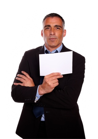 Portrait of a mature business man holding a white card with copyspace on isolated backgroundの写真素材