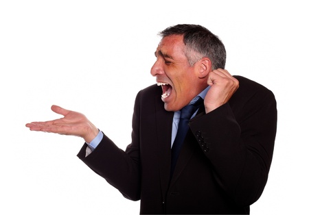 Portrait of a surprised adult man with extended right hand against white backgroundの写真素材