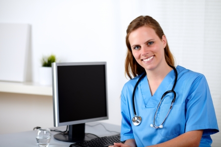 Portrait of a beautiful caucasian nurse on workplaceの写真素材