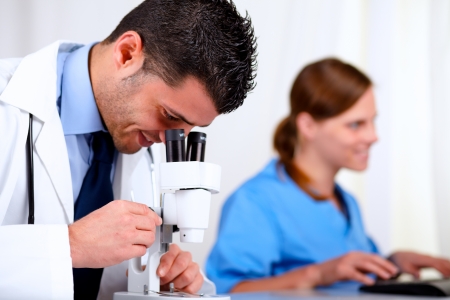 Portrait of two medical colleagues working at laboratory at hospitalの写真素材