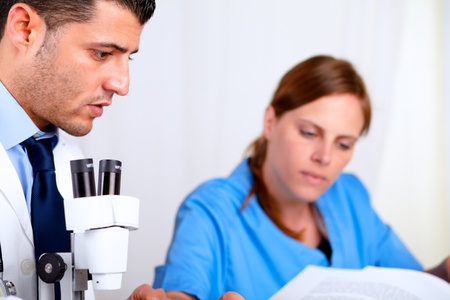 Portrait of two colleagues working at laboratory at hospital indoorの写真素材