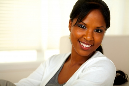 Portrait of a stylish young woman looking at you at home indoor. With copyspaceの写真素材