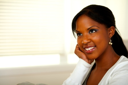 Portrait of a relaxed afro-American young female smiling. With copyspaceの写真素材