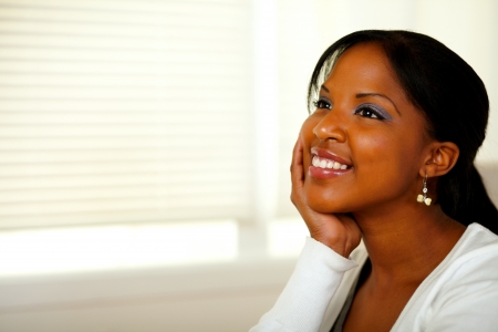 Portrait of a relaxed afro-American young woman smiling. With copyspaceの写真素材
